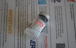 vial of moderna vaccine to illustrate vacci-dating