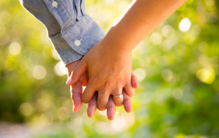 two hands holding to illustrate Jewish matchmaking