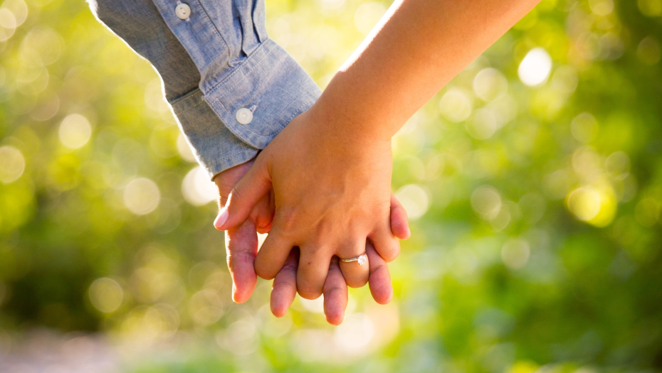 two hands holding to illustrate Jewish matchmaking