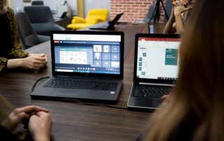 Team discusses projects during a virtual and in-person meeting in a Dubai office.