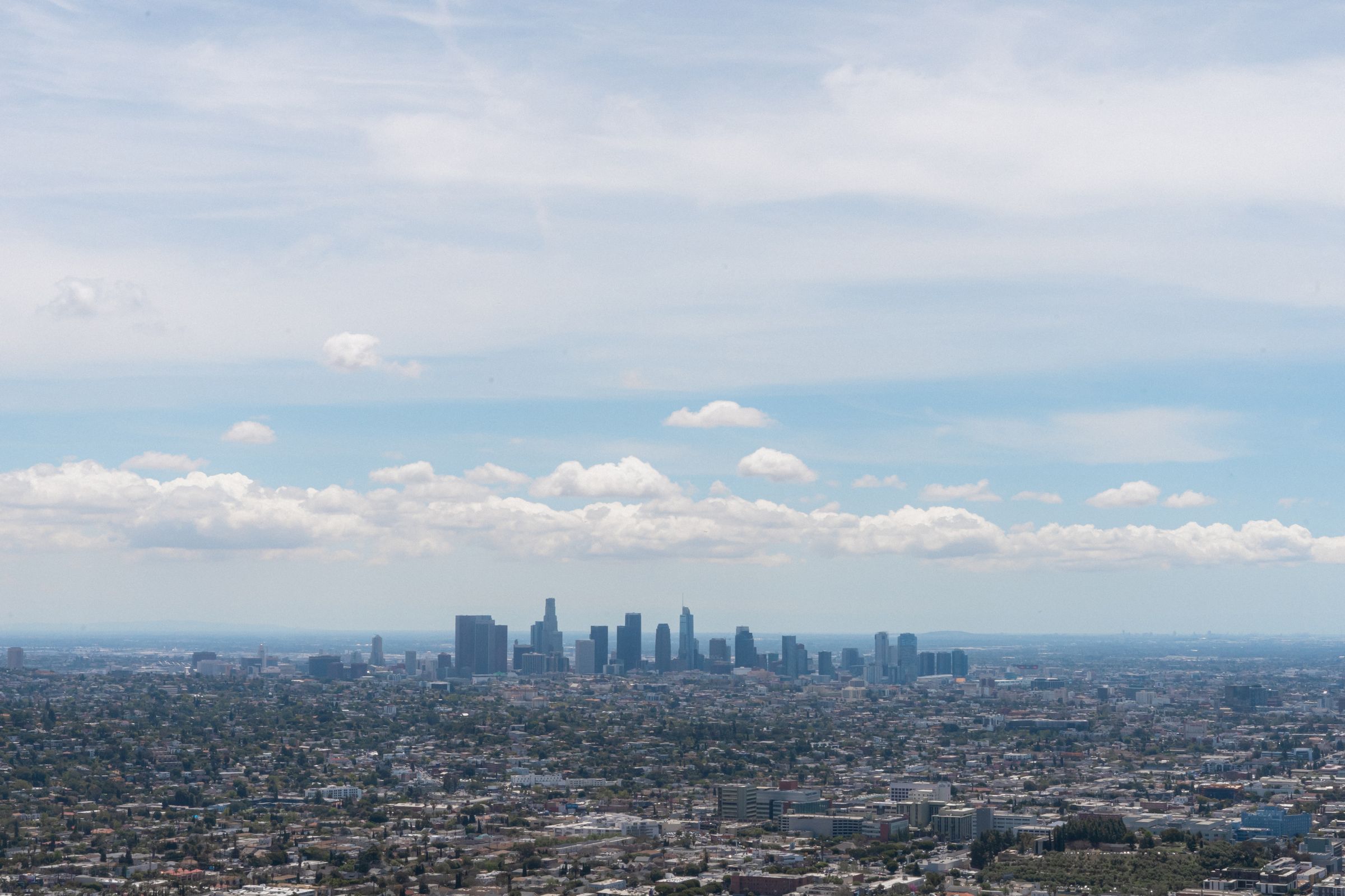 Aerial view of the Los Angeles skyline under a clear blue sky