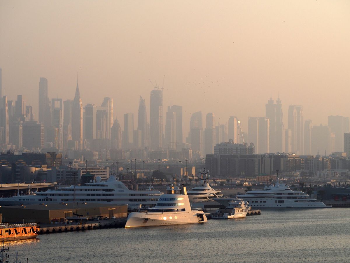 Dubai Marina skyline with yachts in the morning light