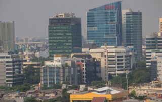 Aerial view of Jakarta's urban skyline showcasing modern skyscrapers and bustling city life.
