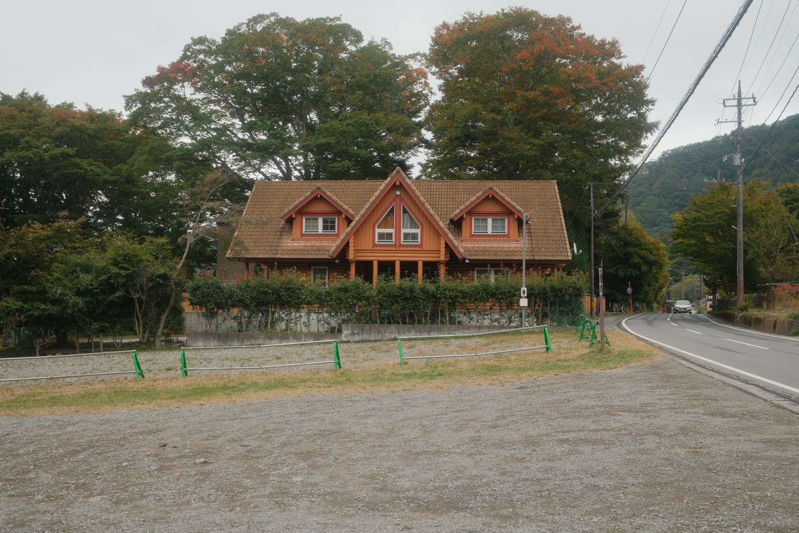 Quaint wooden house surrounded by lush greenery in Fujikawaguchiko, Yamanashi, Japan.
