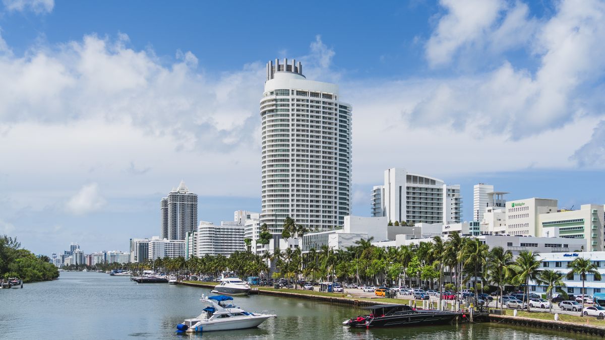 Miami Beach skyline and waterfront with yachts under a blue sky