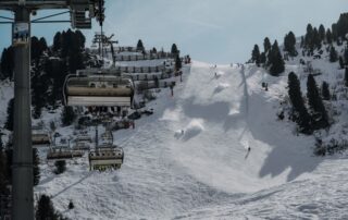 Snowy ski slope with chairlift in Tyrol, Austria, ideal for winter sports.