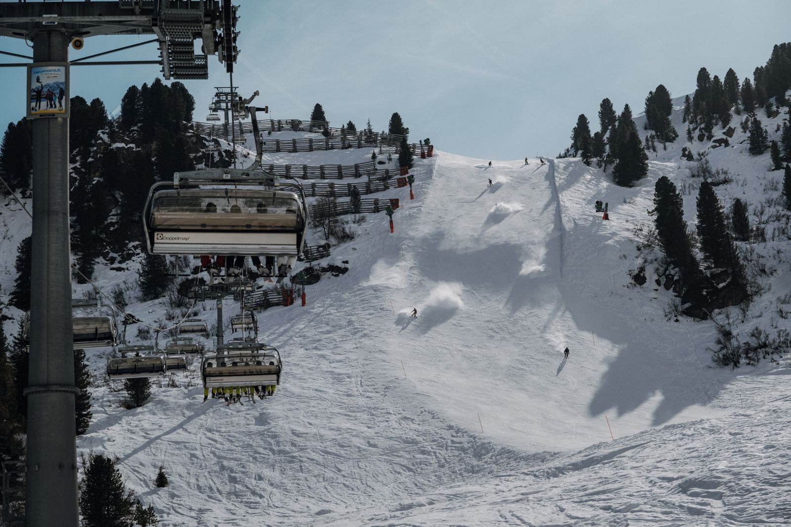 Snowy ski slope with chairlift in Tyrol, Austria, ideal for winter sports.