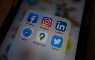 Close-up view of popular social media app icons on a smartphone screen.